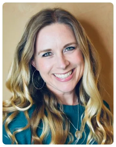 Marcelle Little smiling in a close portrait.